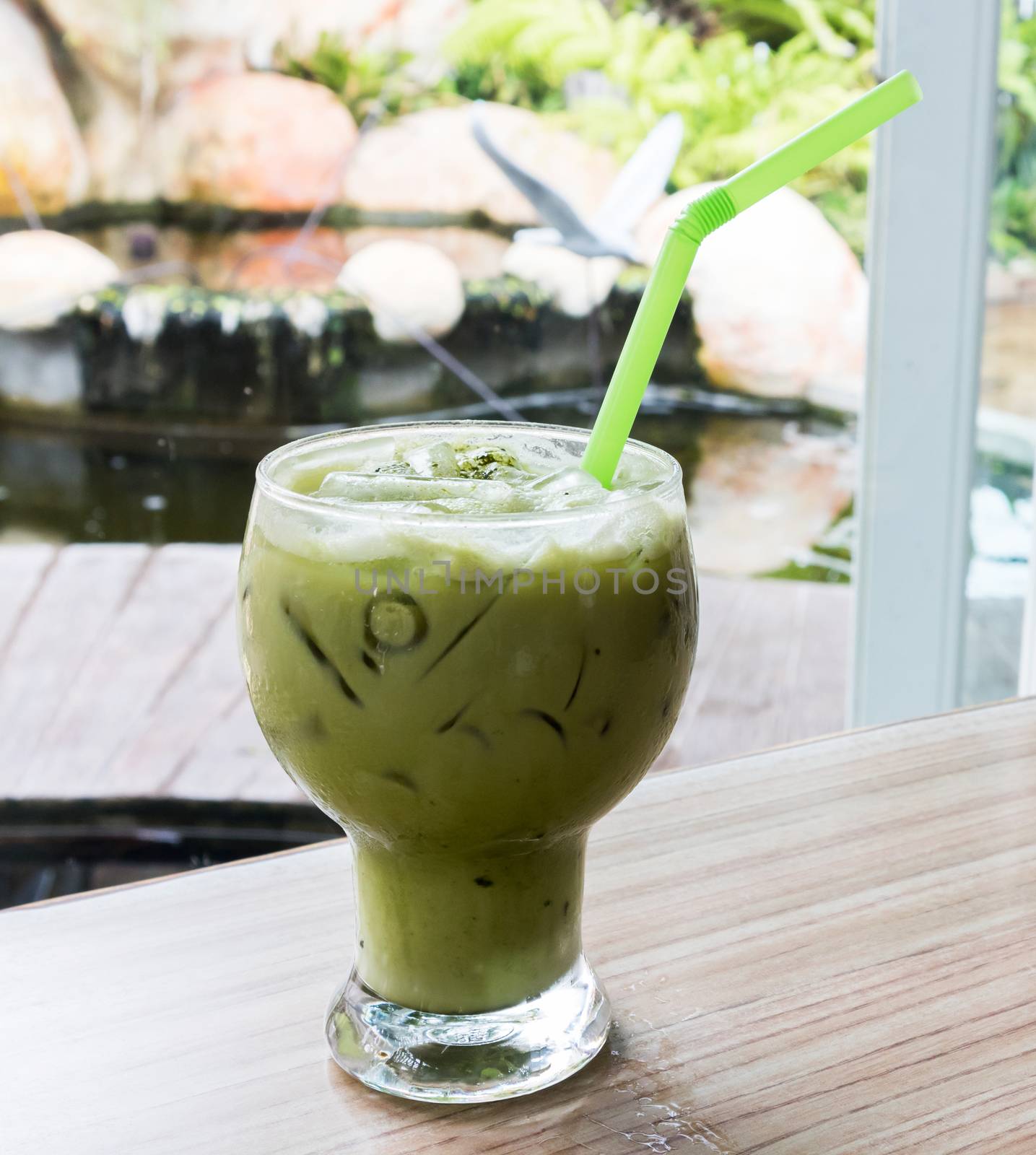 Matcha latte iced on the table by pt.pongsak@gmail.com