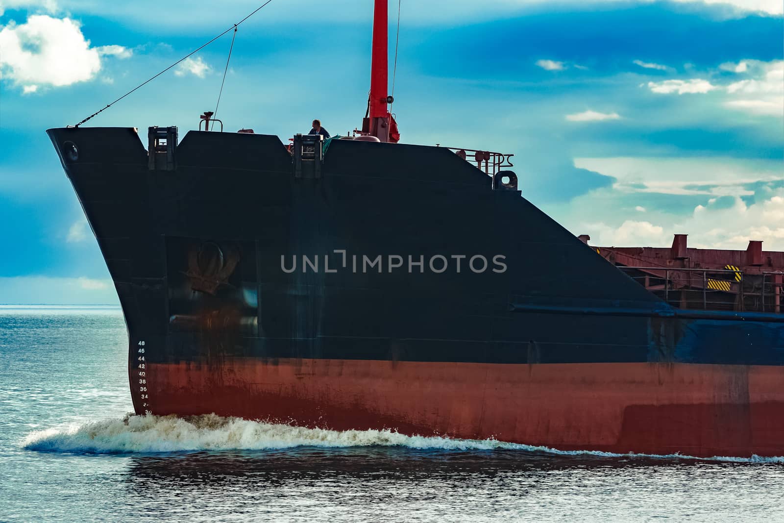 Black bulk carrier sailing from the Baltic sea