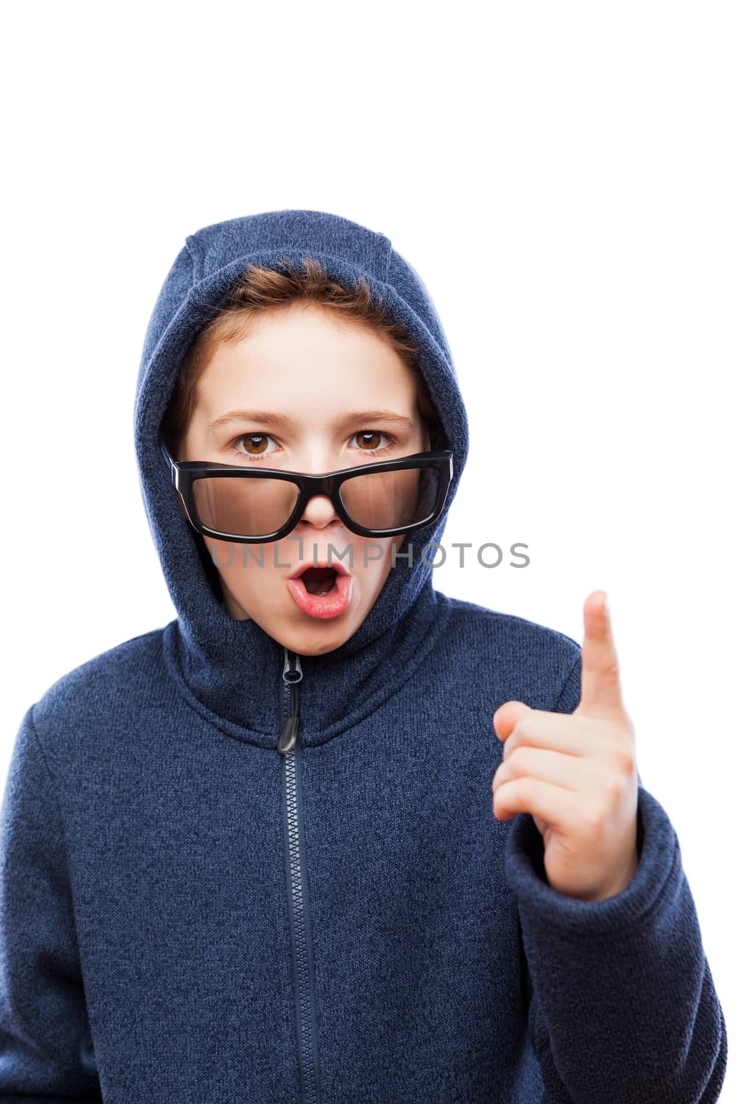 Amazed or surprised teenager boy wearing glasses gesturing exclamation point finger sign white isolated
