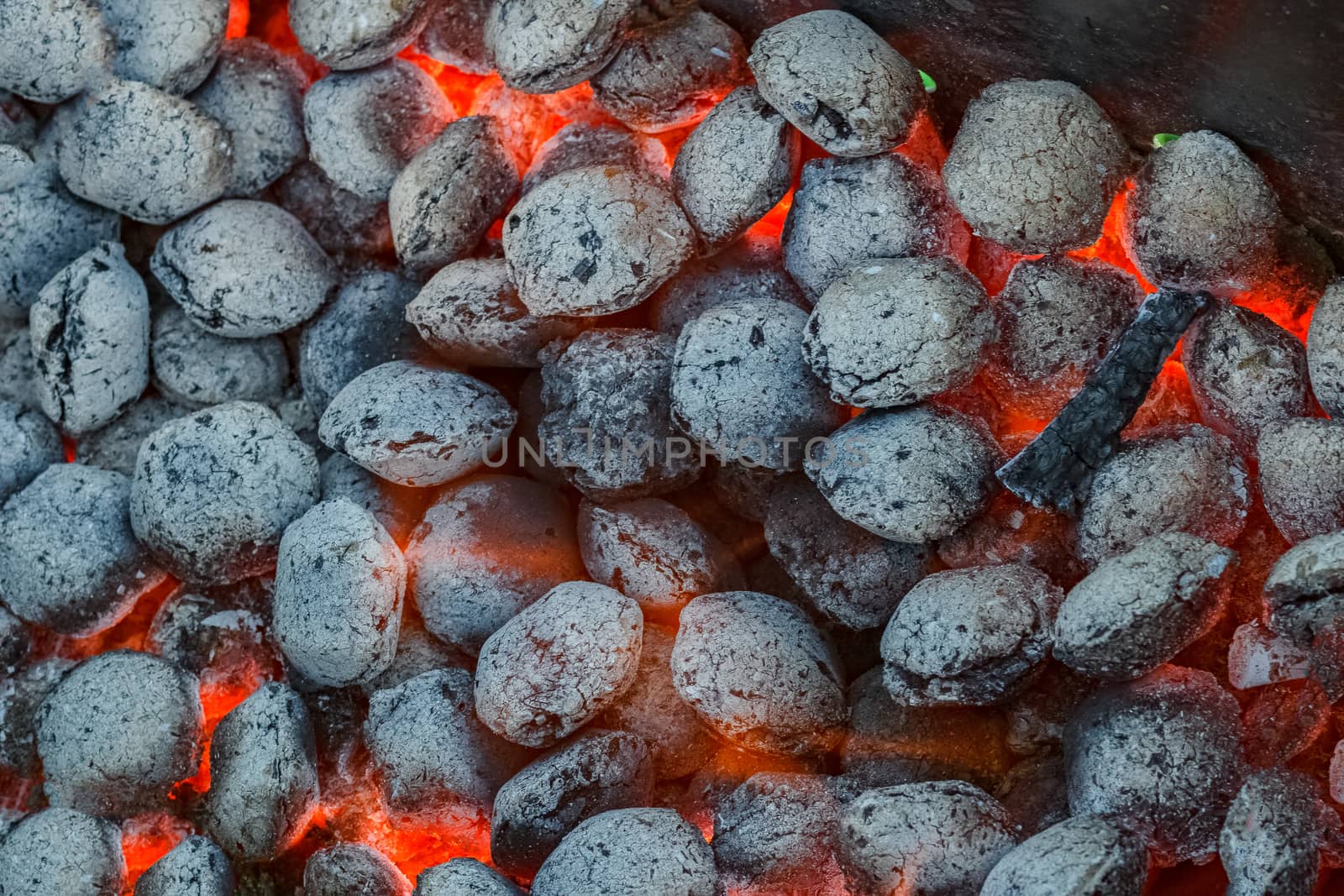 Hot flamed barbecue coal in a grill at summer party