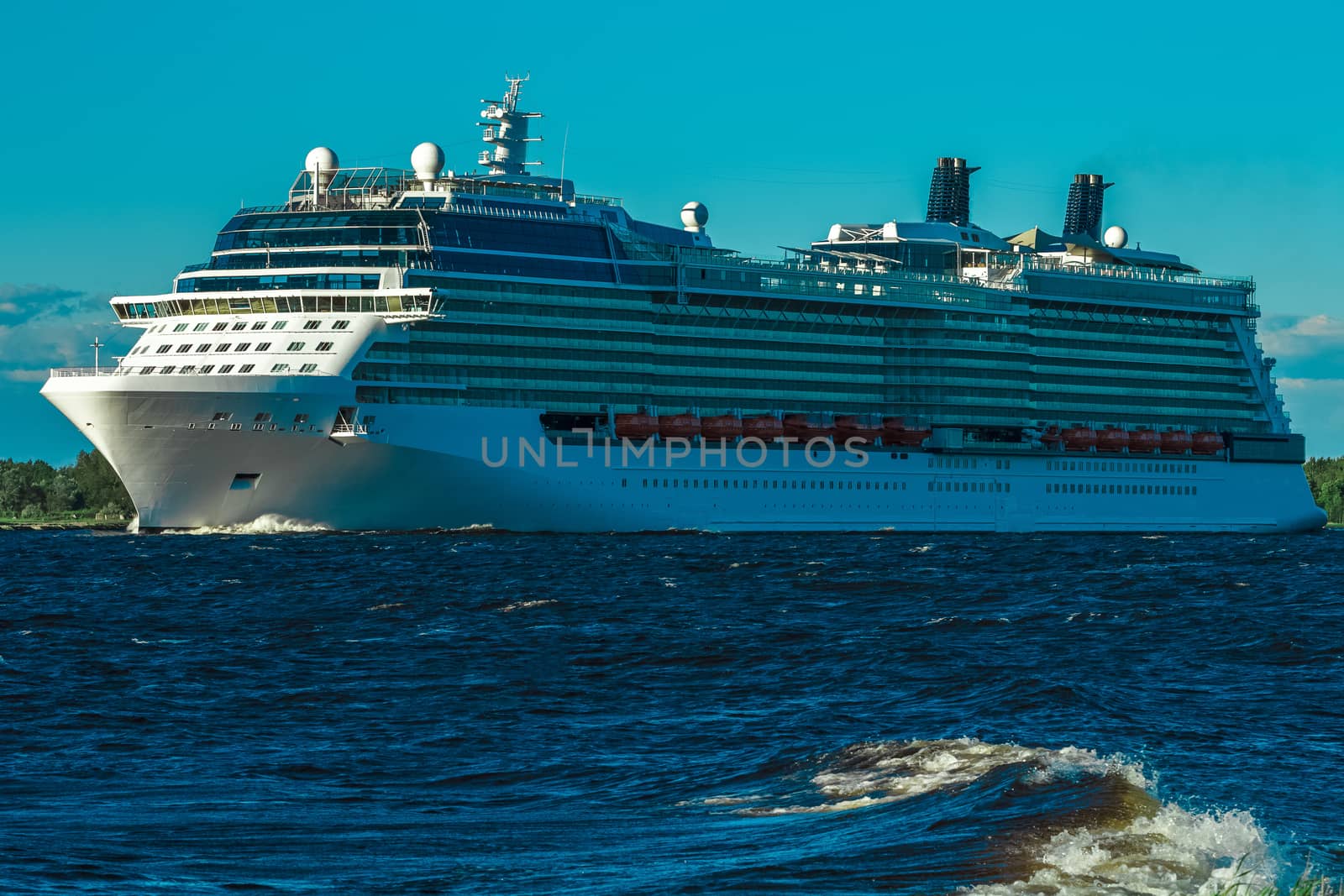Big white cruise ship sailing to the Baltic sea at clear day