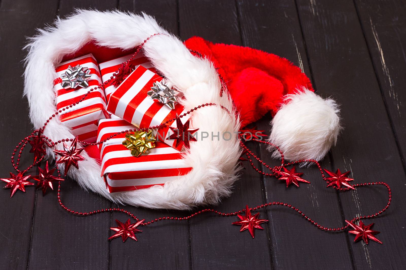 Christmas gifts in a Santa Claus hat by victosha