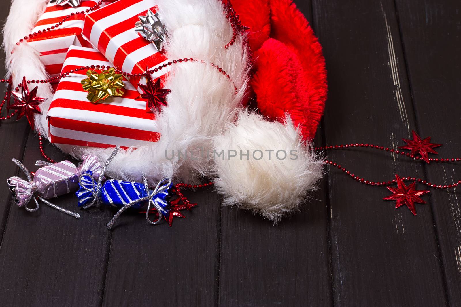 Christmas gifts in a Santa Claus hat by victosha