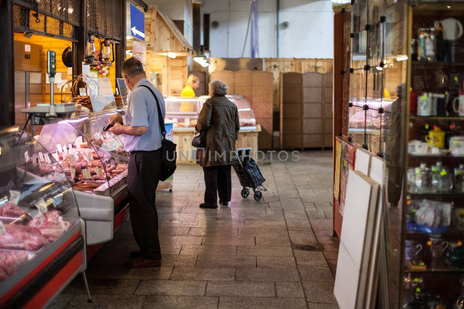 Ancient bazaar. Visitors are considering the range