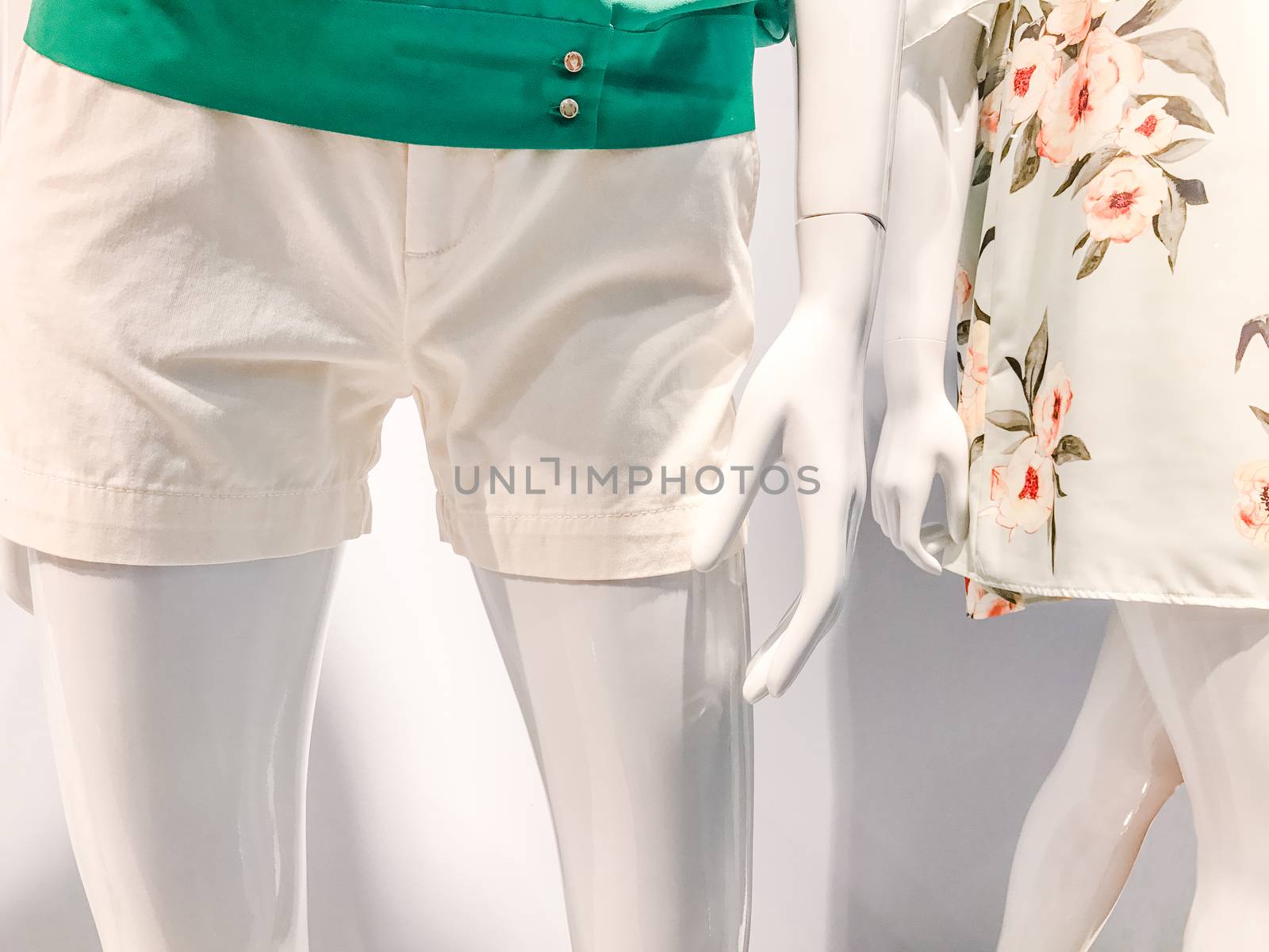 Mannequin in the window of a clothing store by Softulka