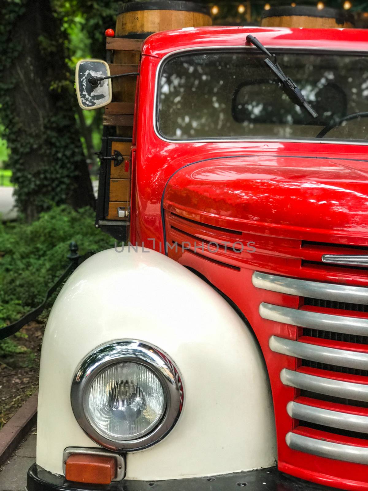 Vintage old red truck behind restaurant