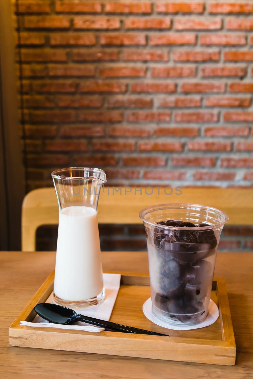 Frozen chocolate with fresh milk on wooden table by luckyfim