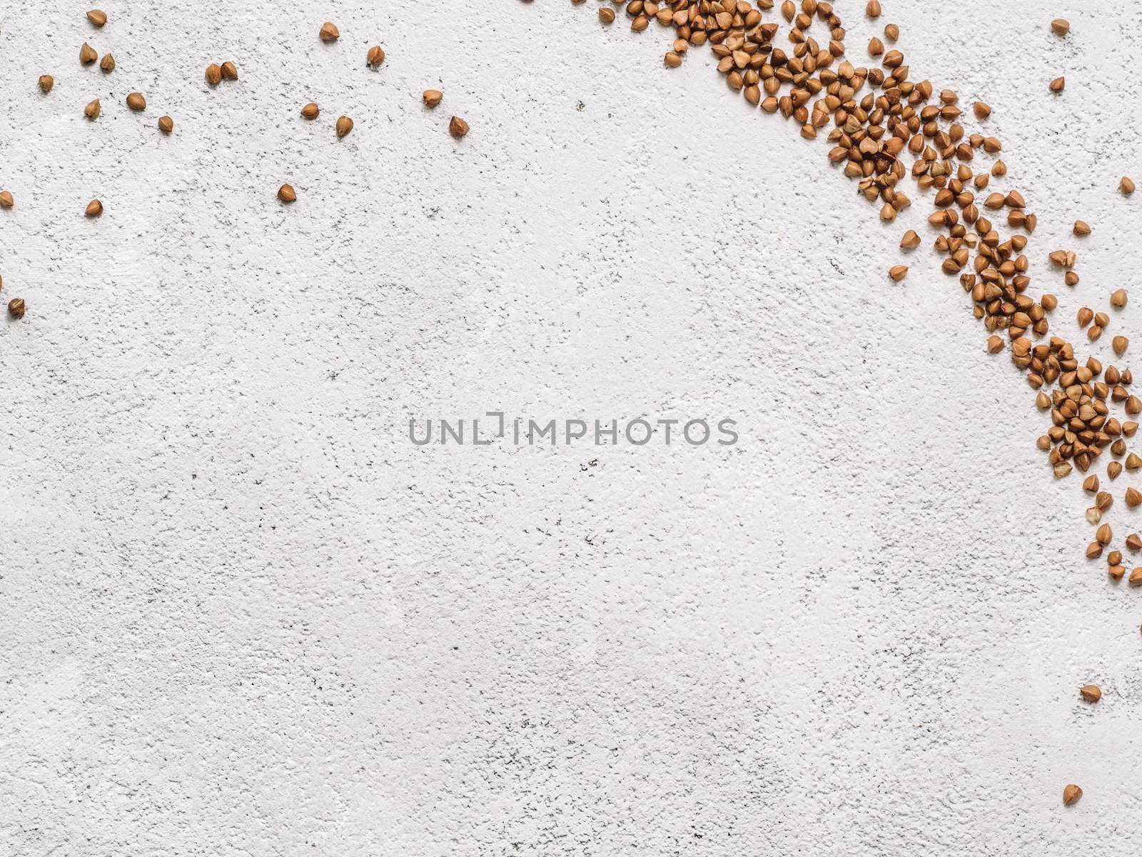 Flax seeds with copy space. Brown flax seed on gray concrete textured background. Top view or flat lay. Copy space. Healthy food and diet concept