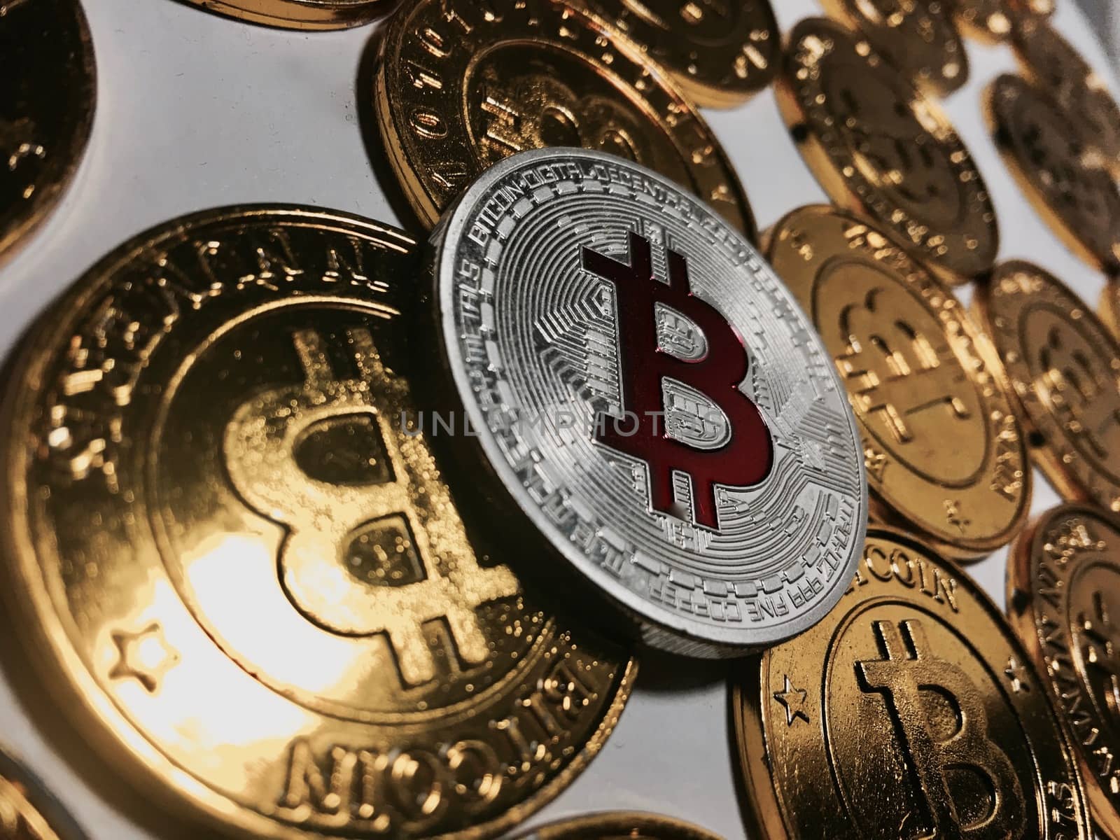 Digital currency physical metal bitcoin coin on the gold bitcoins. Cryptocurrency concept.