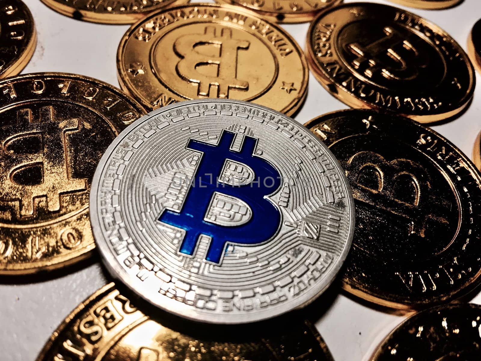Digital currency physical metal bitcoin coin on the gold bitcoins. Cryptocurrency concept.