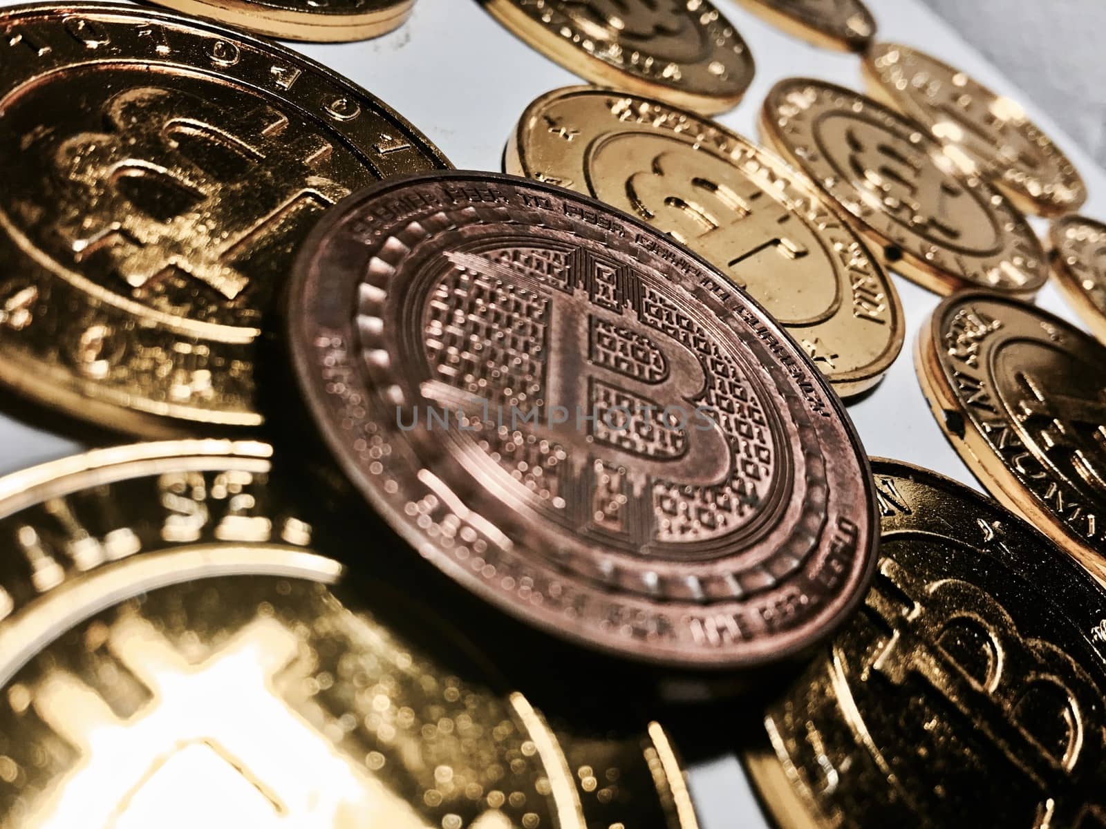 Digital currency physical metal bitcoin coin on the gold bitcoins. Cryptocurrency concept.