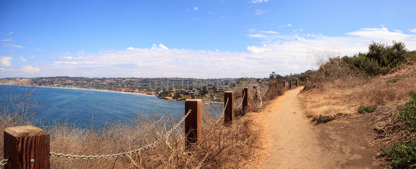Hiking trails and benches above the coastal area of La Jolla Cove in Southern California in summer on a sunny day