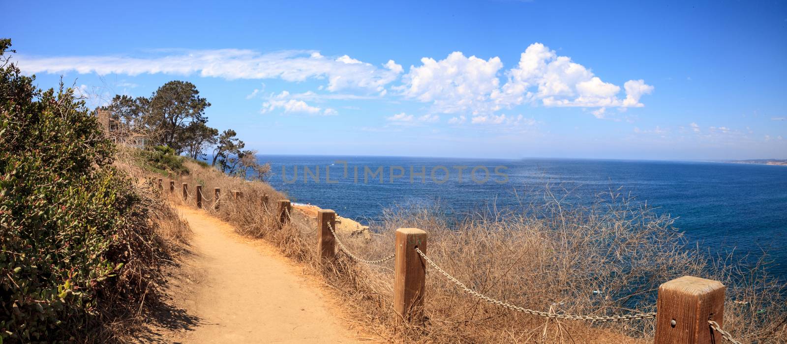 Hiking trails and benches above the coastal area of La Jolla Cove in Southern California in summer on a sunny day