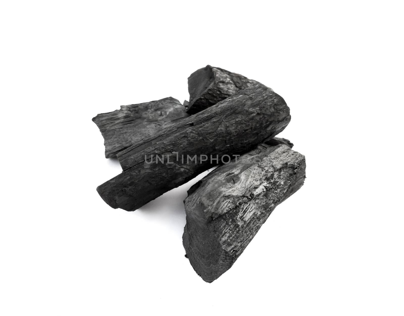 Closeup Black charcoal on white background, raw material for make cooking