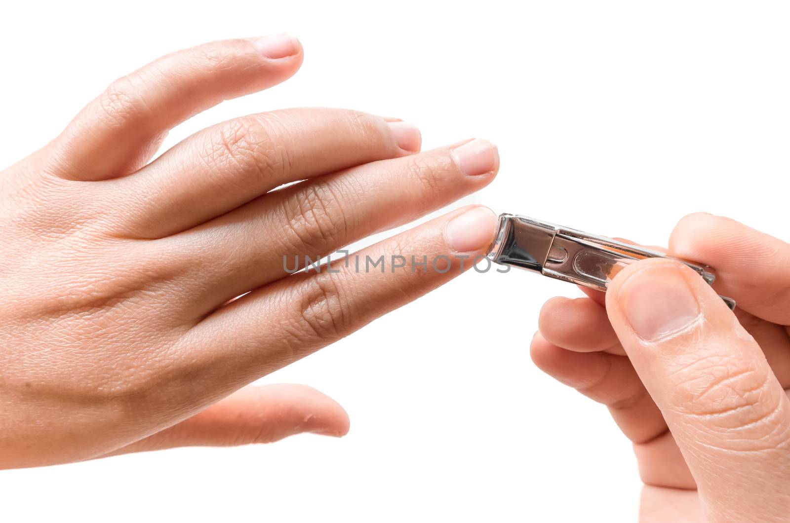 Closeup women cut fingernails on white background