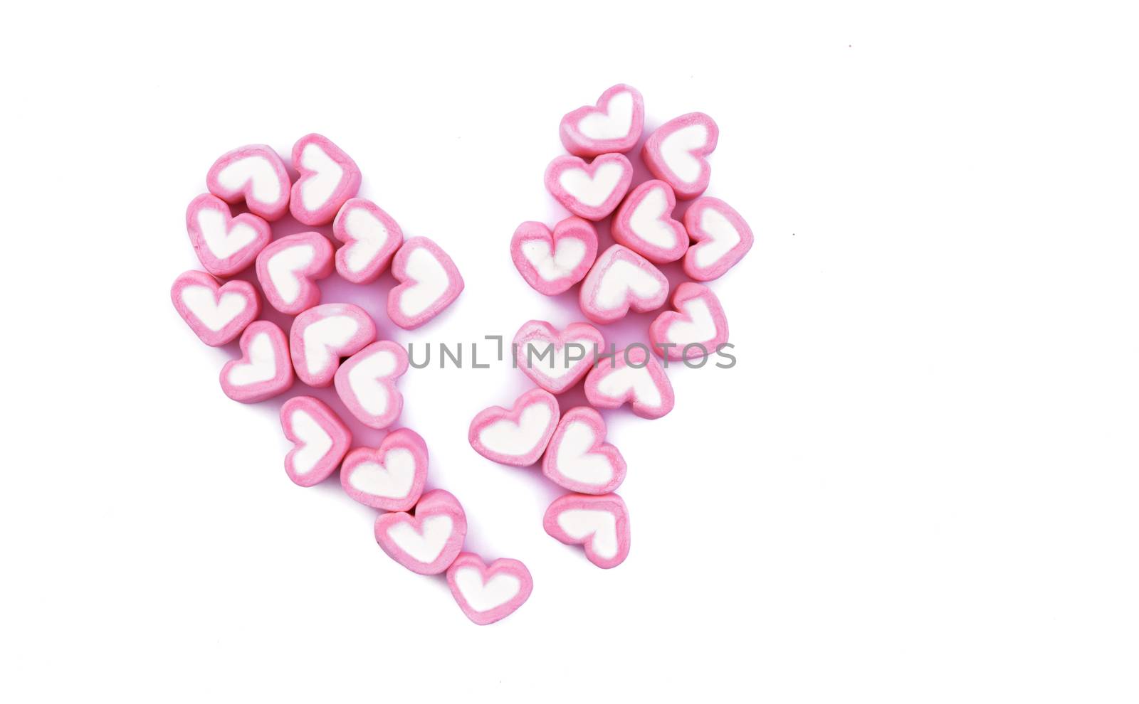 Pink broken heart marshmallow on white background