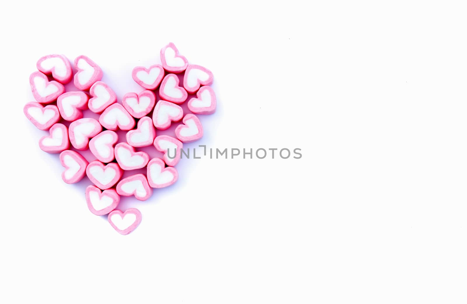 Pink sweet heart shape love marshmallow for love concept on white background