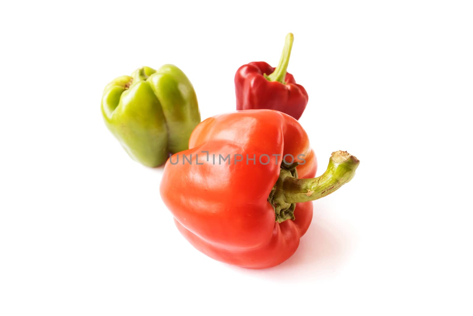 Red and green sweet pepper on white background