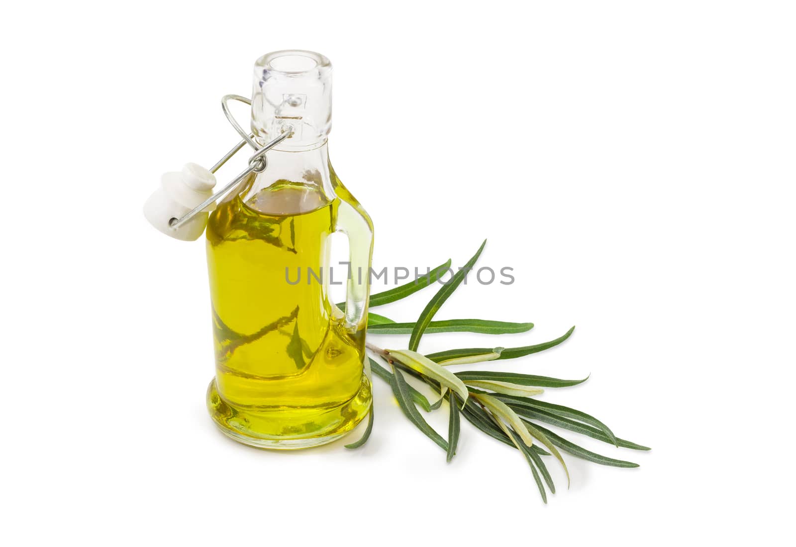 Small glass bottle of olive oil with opened lockable lid and olive branch beside on a white background
