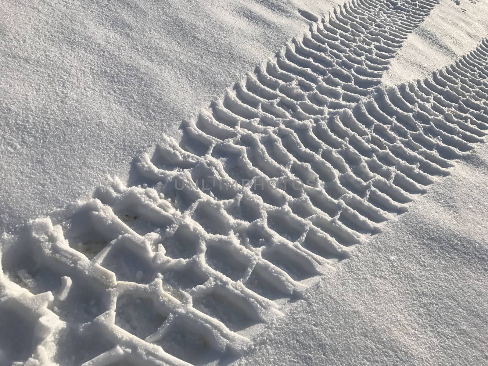 traces of the land vehicle on the snow