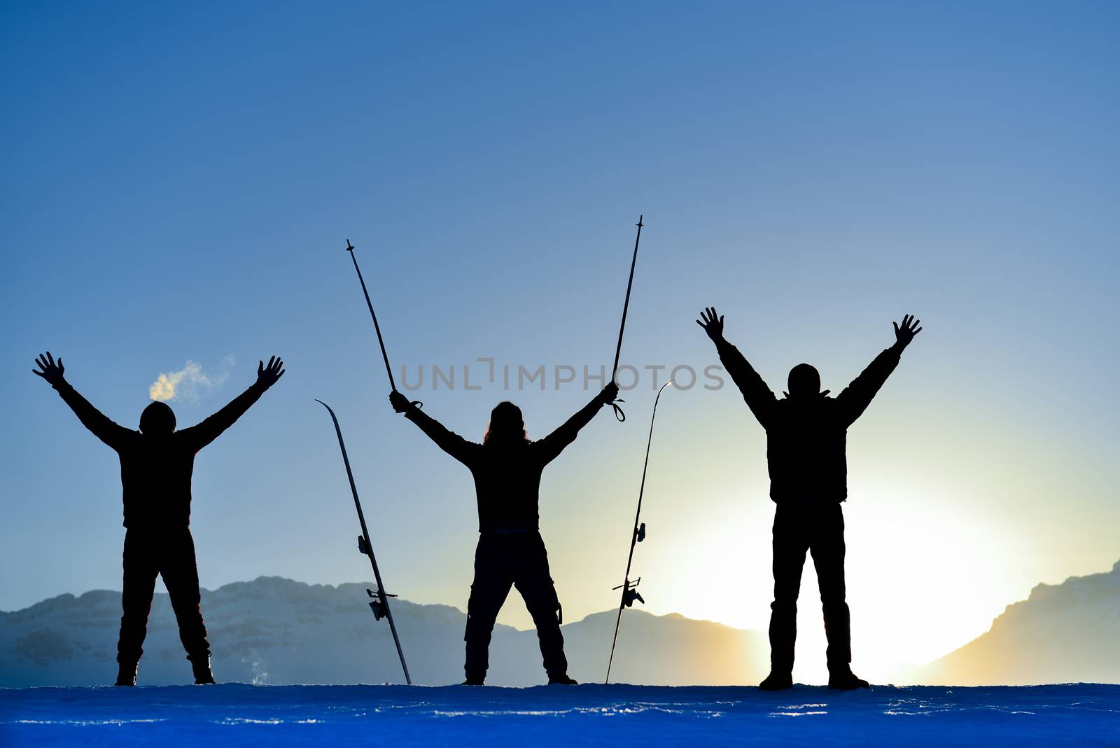 friends reaching the point of destination in the mountains