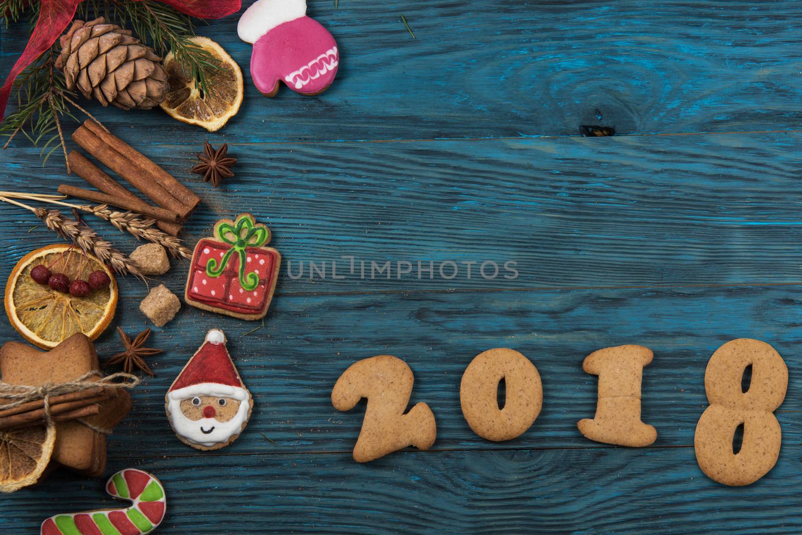 Gingerbreads for new 2017 year on wooden background, xmas theme