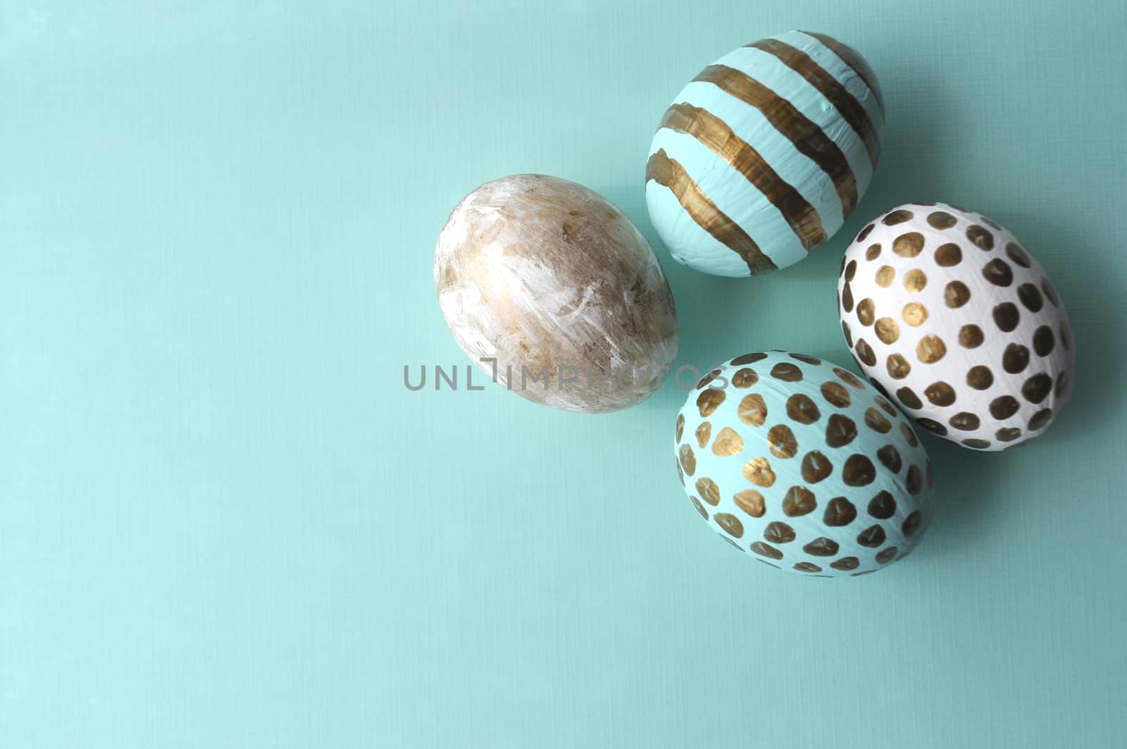 Teal turquoise aqua polka dots decorated Easter eggs with mint copy space. by Akvals
