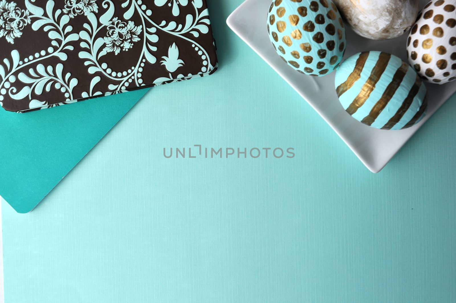 Teal mint turquoise floral notebook with aqua polka dots decorated Easter eggs with copy space