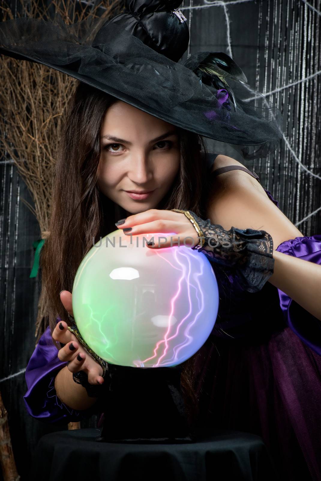 portrait of a witch with a magic ball for predictions