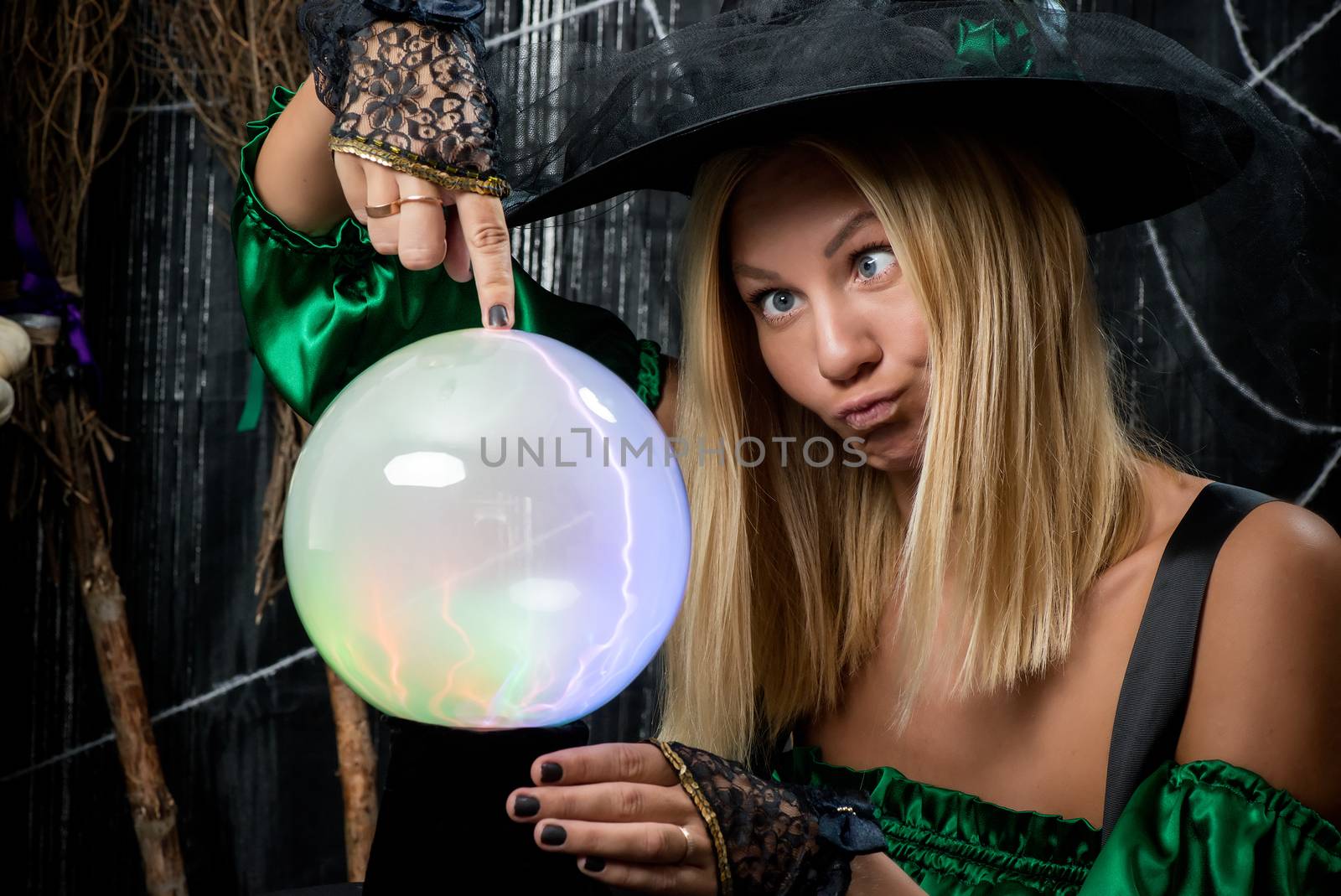 Beautiful young witch posing with magic ball by kosmsos111