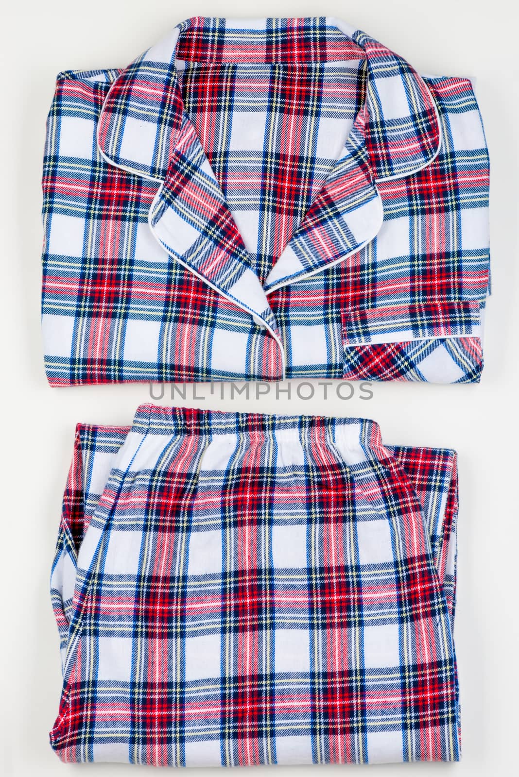 Checkered classic warm pajamas on white background closeup