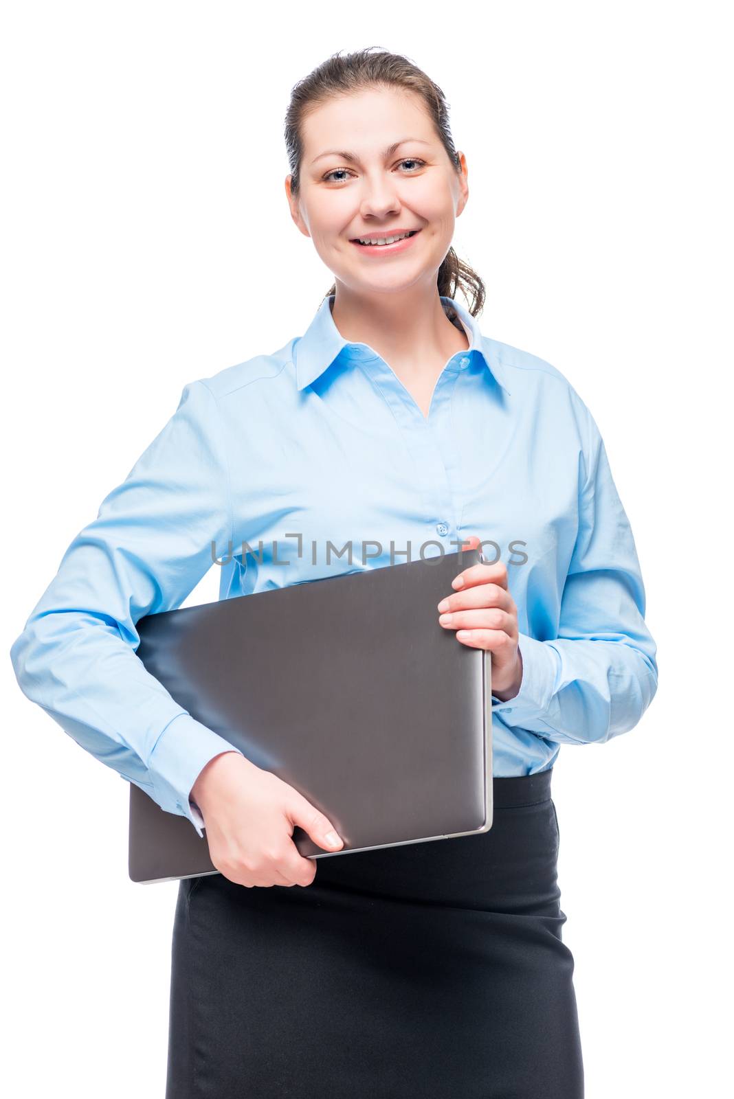 Businesswoman in a blue shirt on a white background with a laptop