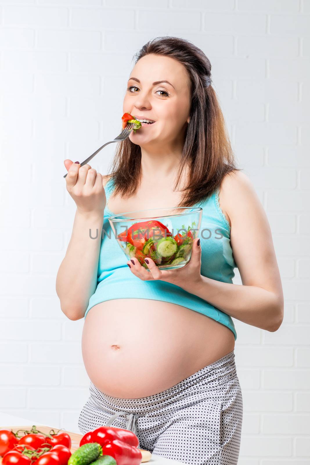 pregnant woman eating fork delicious vegetable salad