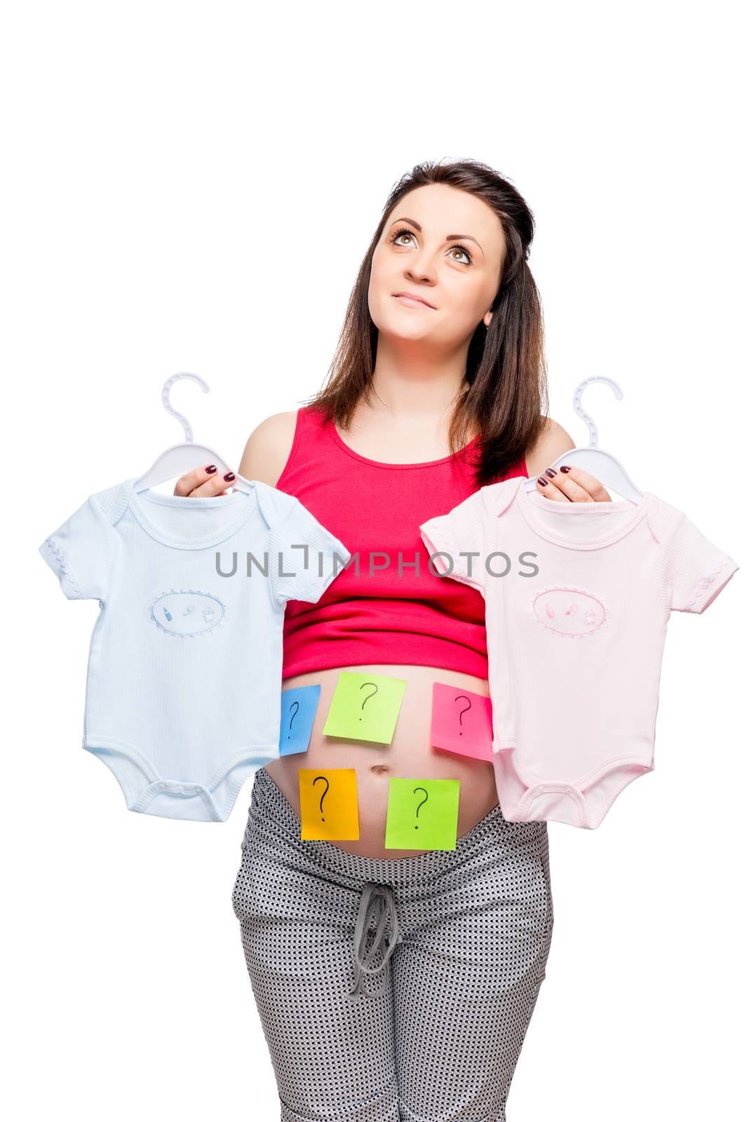 Dreamy woman with clothes for boy and girl conceptual photo