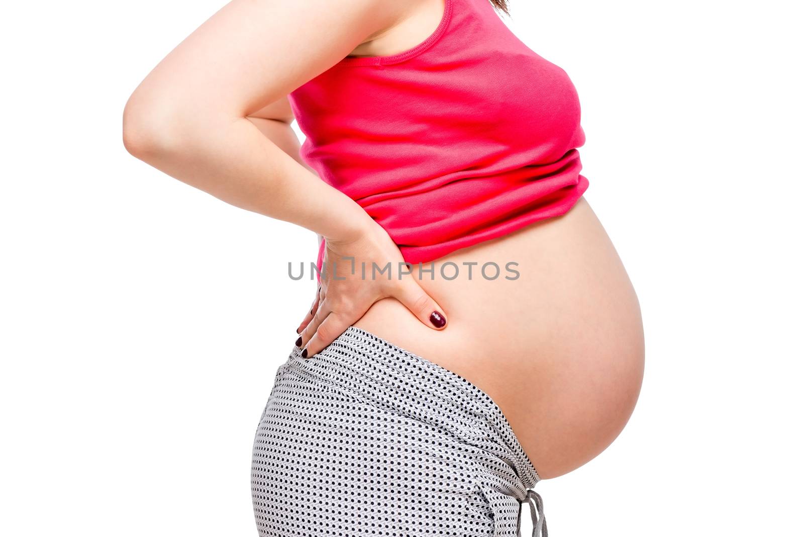 back pain of a pregnant woman, belly close-up isolated
