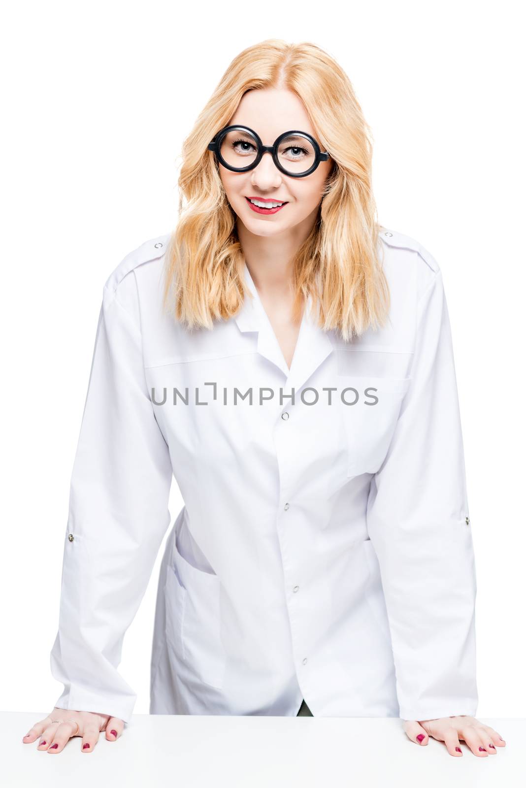 Portrait of a blond doctor with funny glasses on a white background