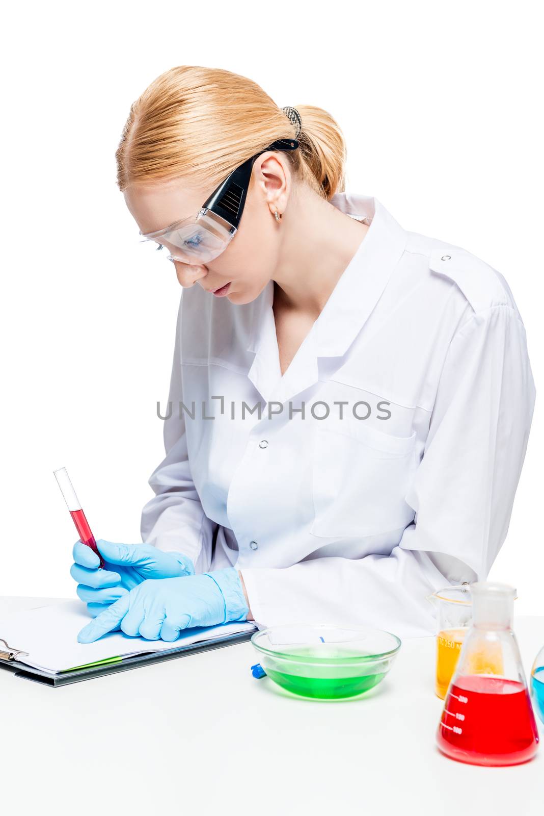 Concentrated microbiologist with a test tube while working