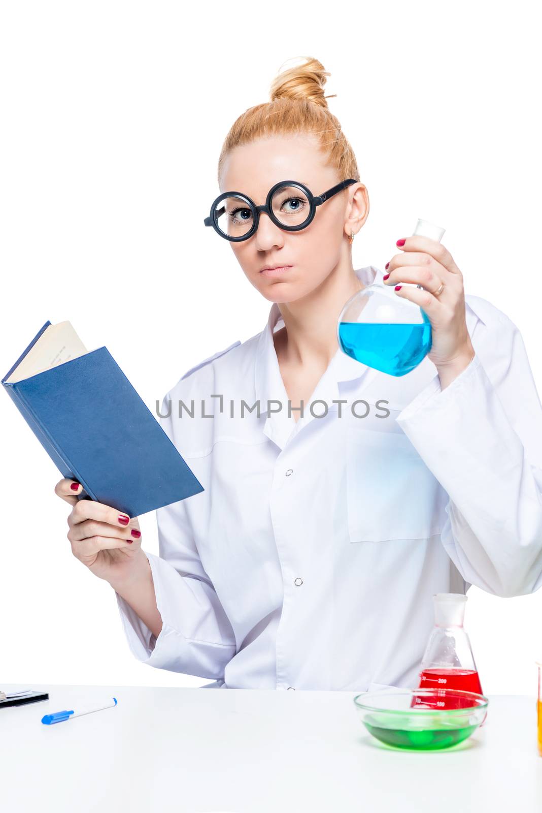 Student with a laboratory bulb and a book posing against a white background