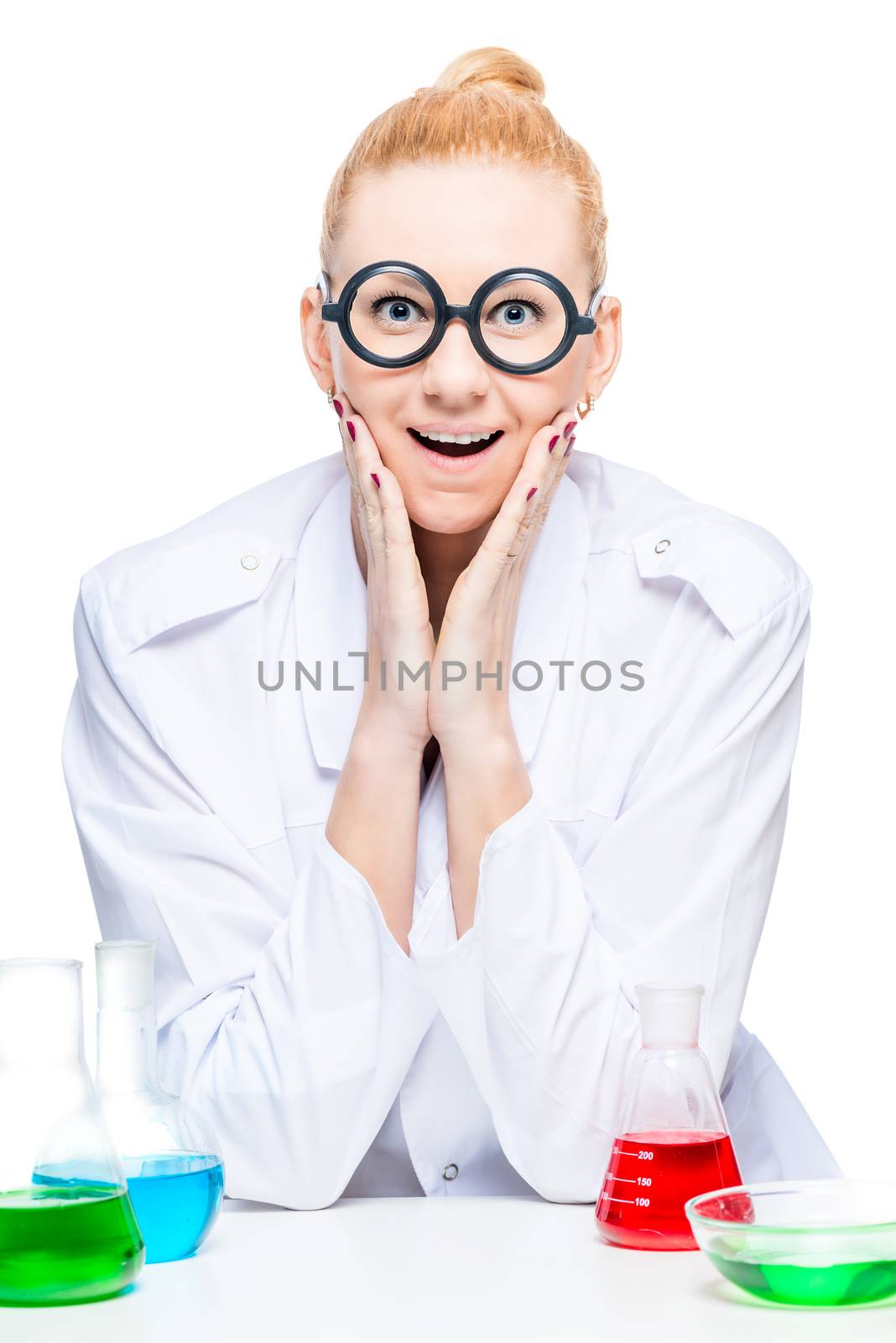 portrait of a joyful chemist in funny glasses with test tubes