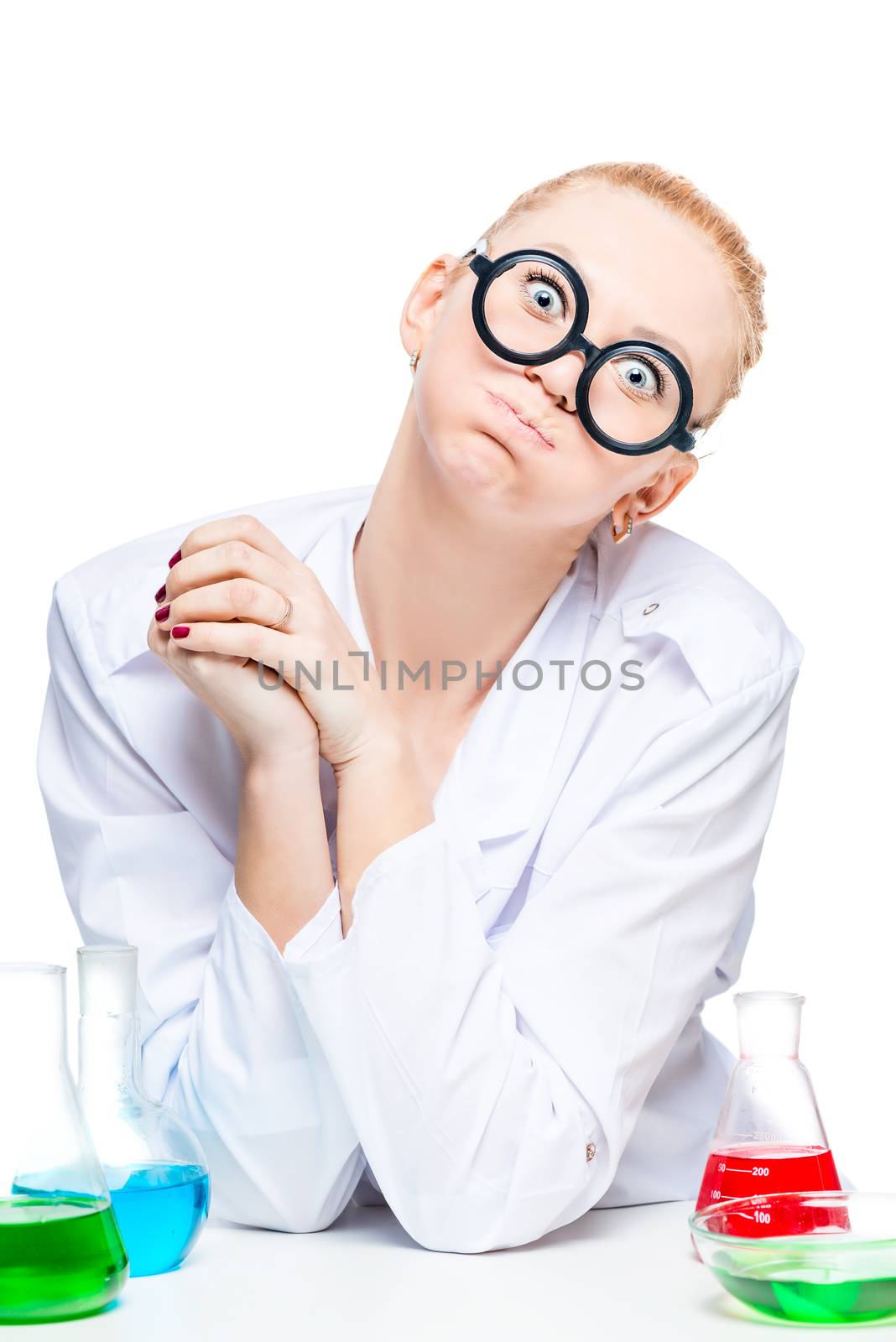 crazy chemist with a funny expression on his face with test tubes