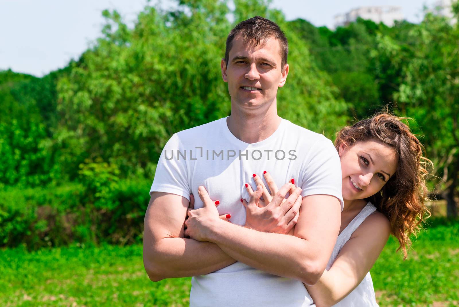 Couple in love hugging on lawn in park, woman waiting for baby by kosmsos111