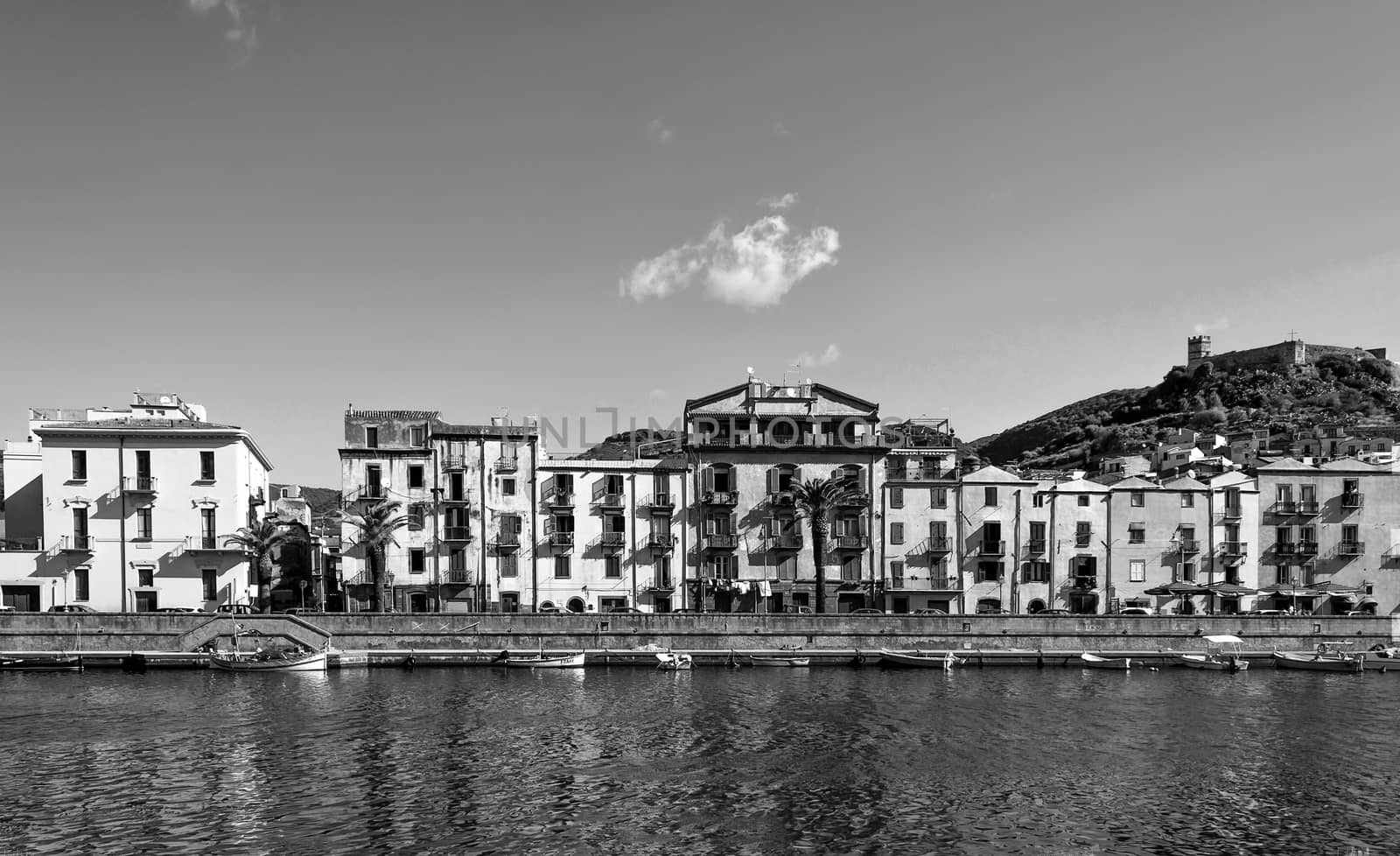 Black and white view of ancient village of Bosa on Temo river in a sunny morning of summer - Sardinia - Italy