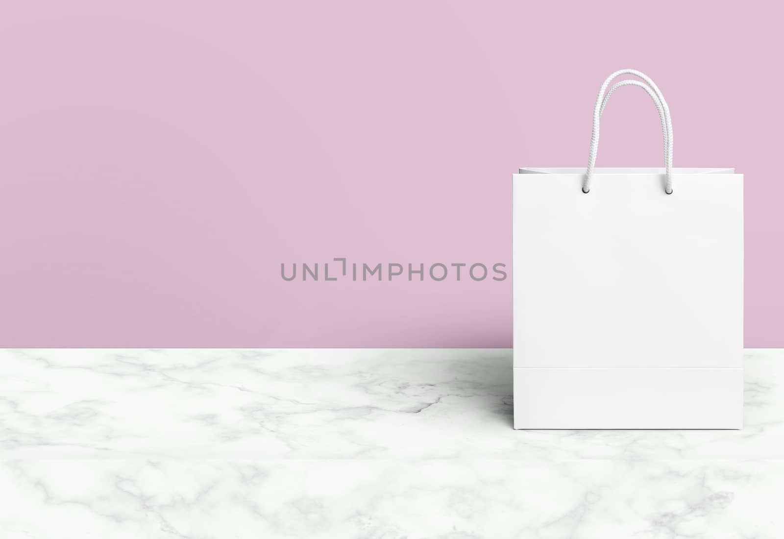 white paper bag for shopping on a pink background by boys1983@mail.ru