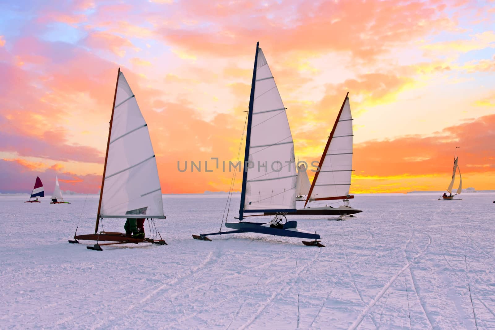 Ice sailing on the Gouwzee in the countryside from the Netherlands at sunset