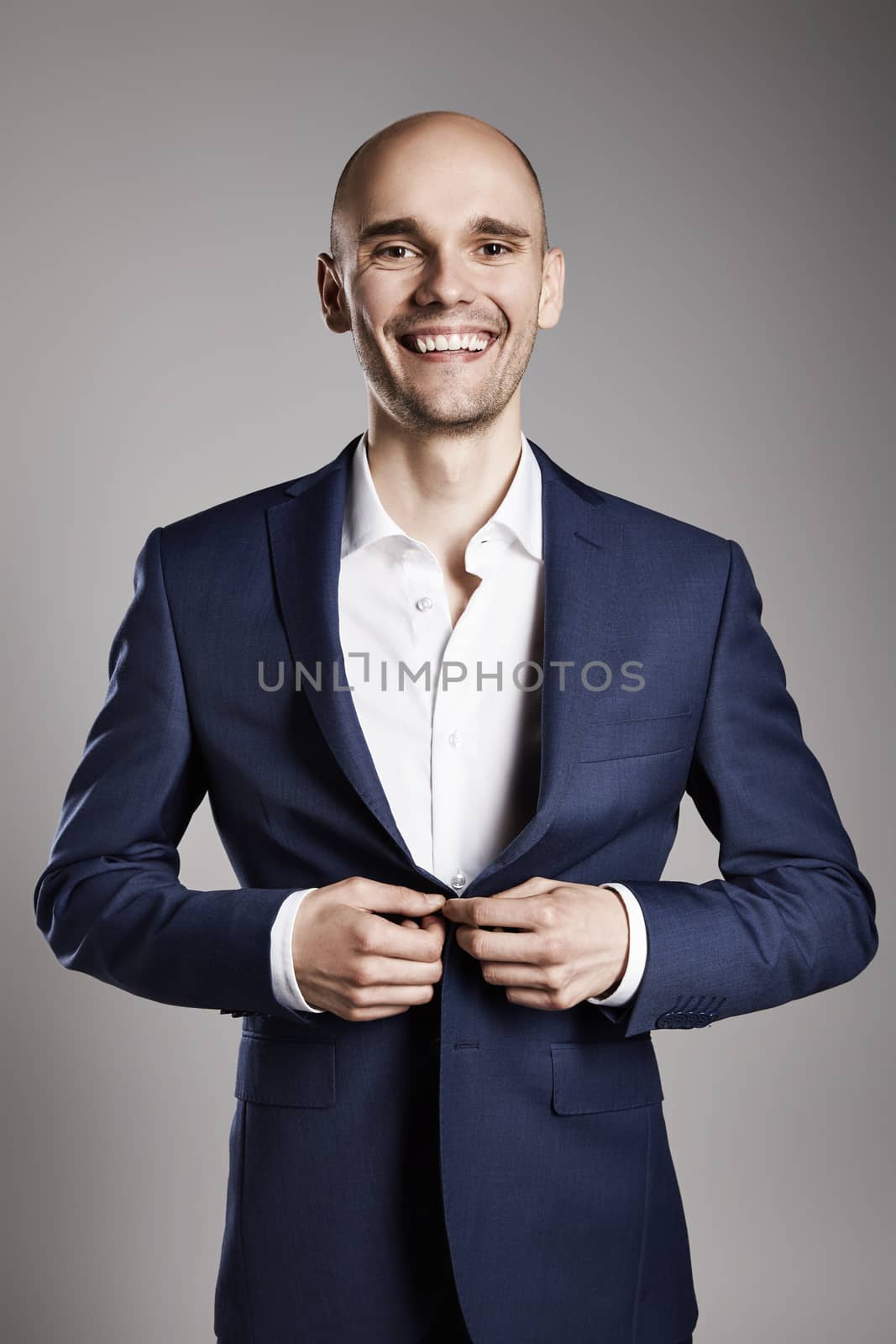 Portrait of young smiling man getting ready.