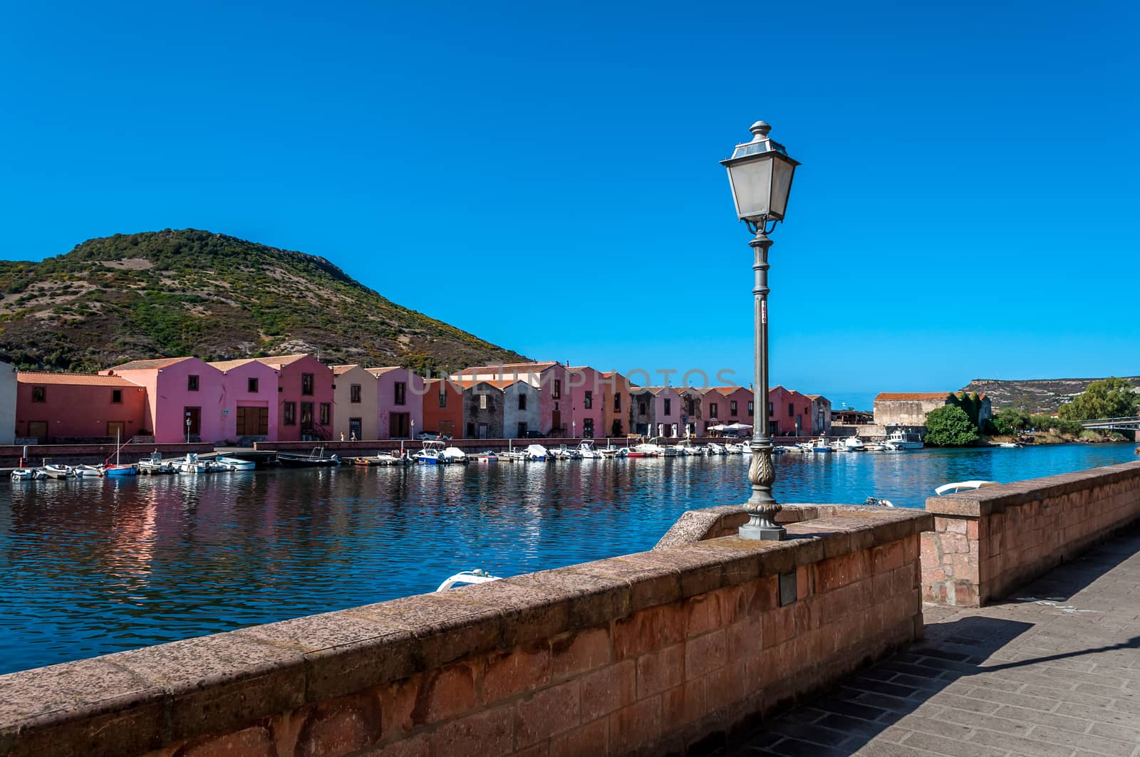 View of ancient village of Bosa on Temo river in a sunny morning of summer - Sardinia - Italy