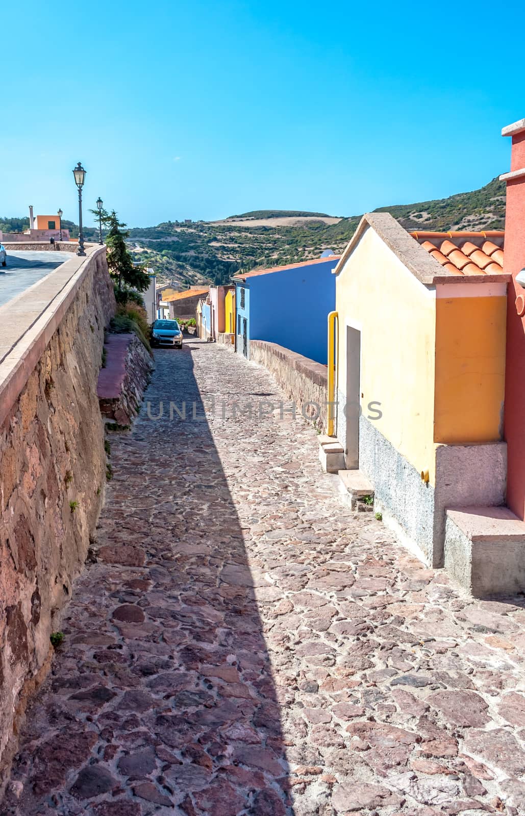 View of ancient village of Bosa on Temo river in a sunny morning of summer - Sardinia - Italy