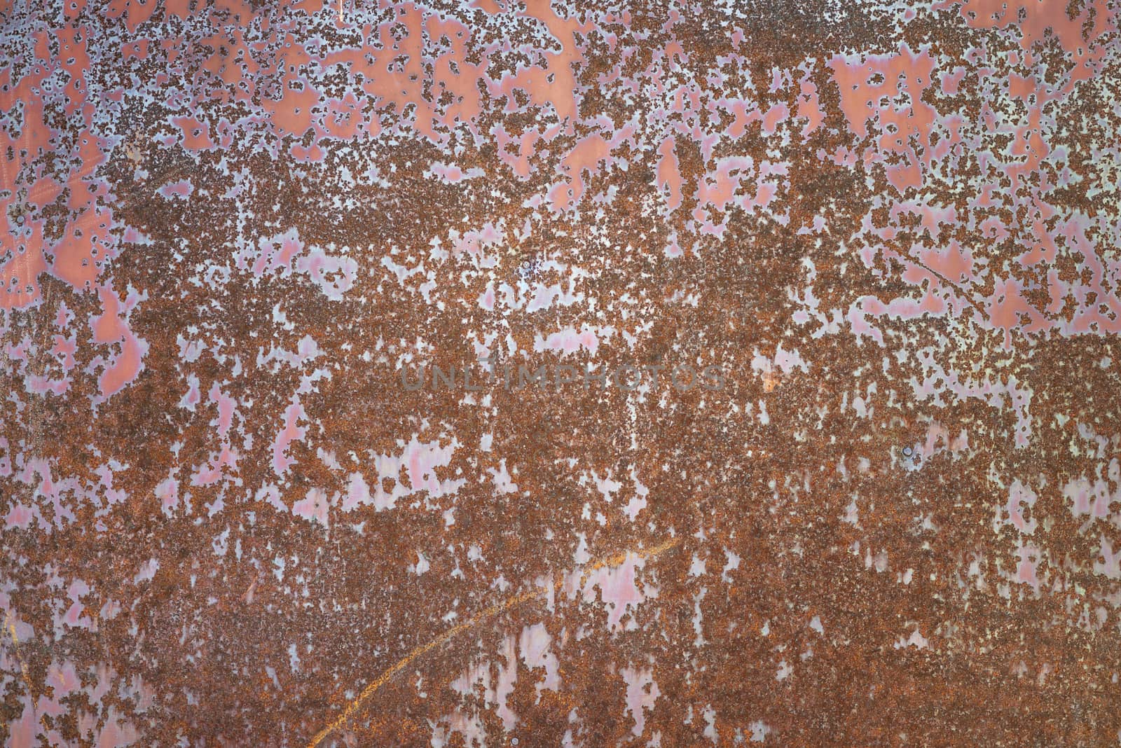 Metal grunge background: rusty metal surface red paint flaking and cracking texture