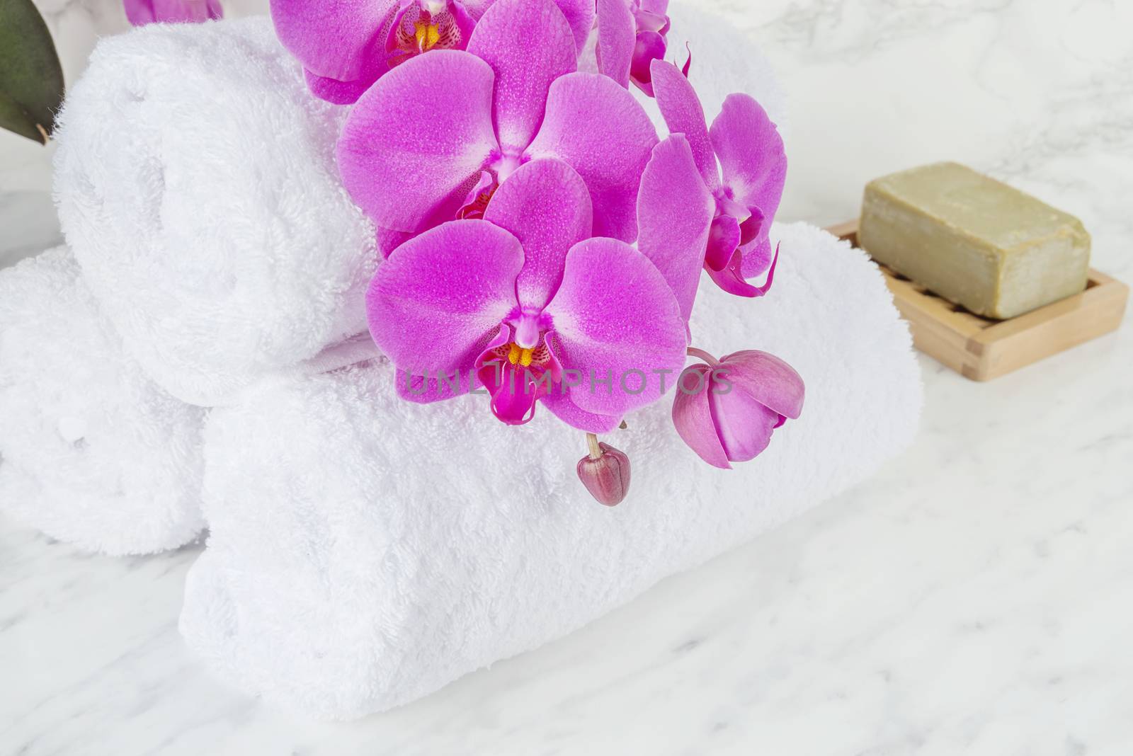 Soap, orchid and towels by Epitavi