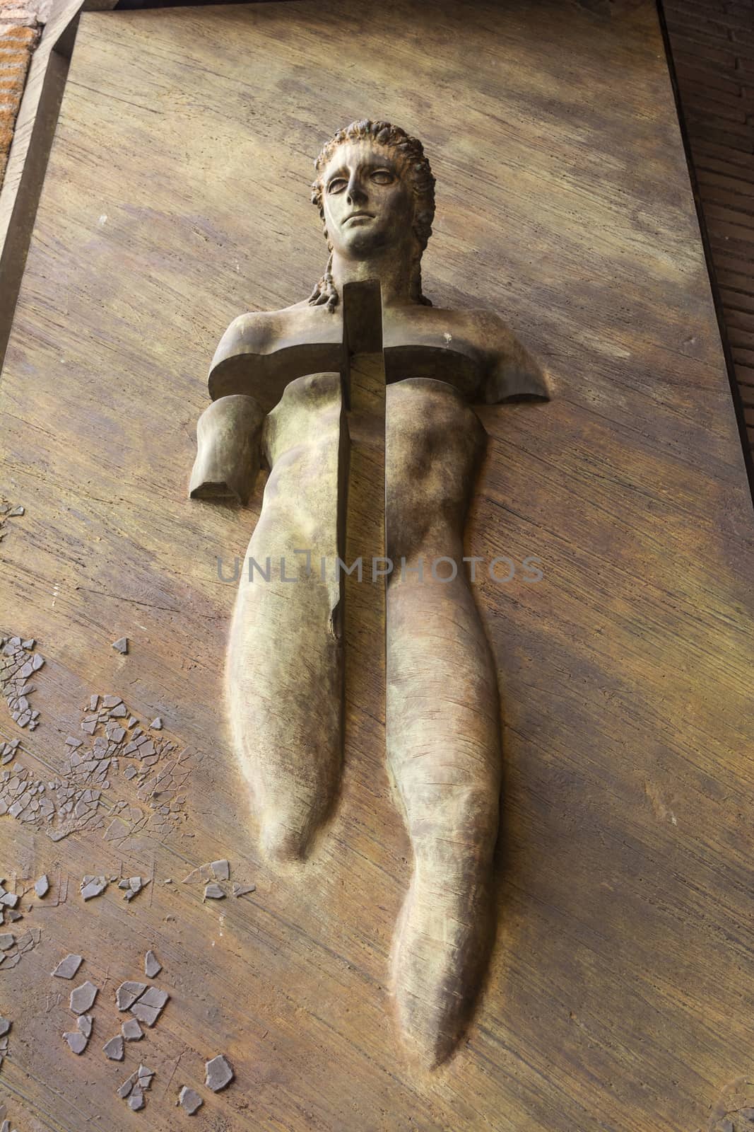 Bronze statue on the door of the Basilica of St. Mary of the Angels and the Martyrs - Rome, Italy by ankarb